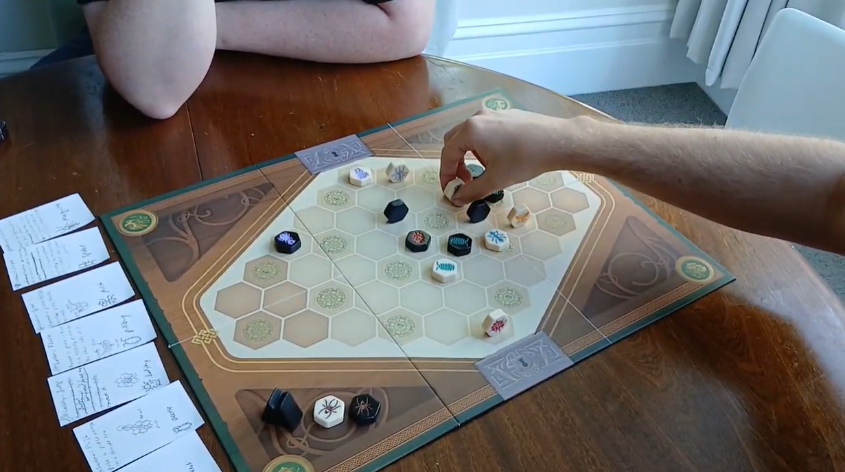 Two players playing the current version of RM using pieces from other games